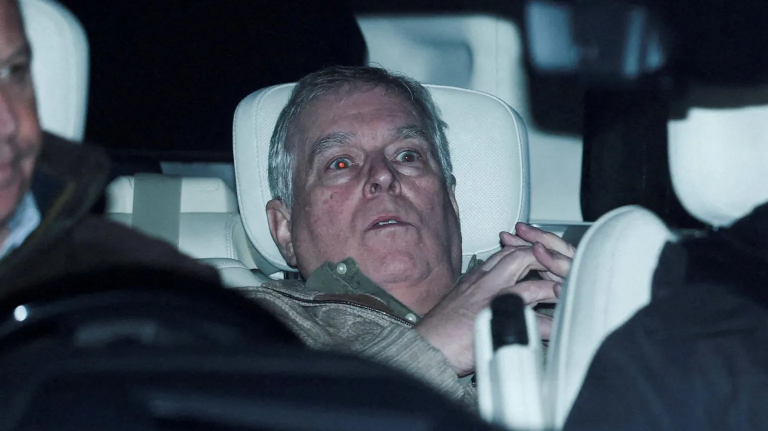 Reuters Andrew Mountbatten-Windsor slumped in the back seat of a car 