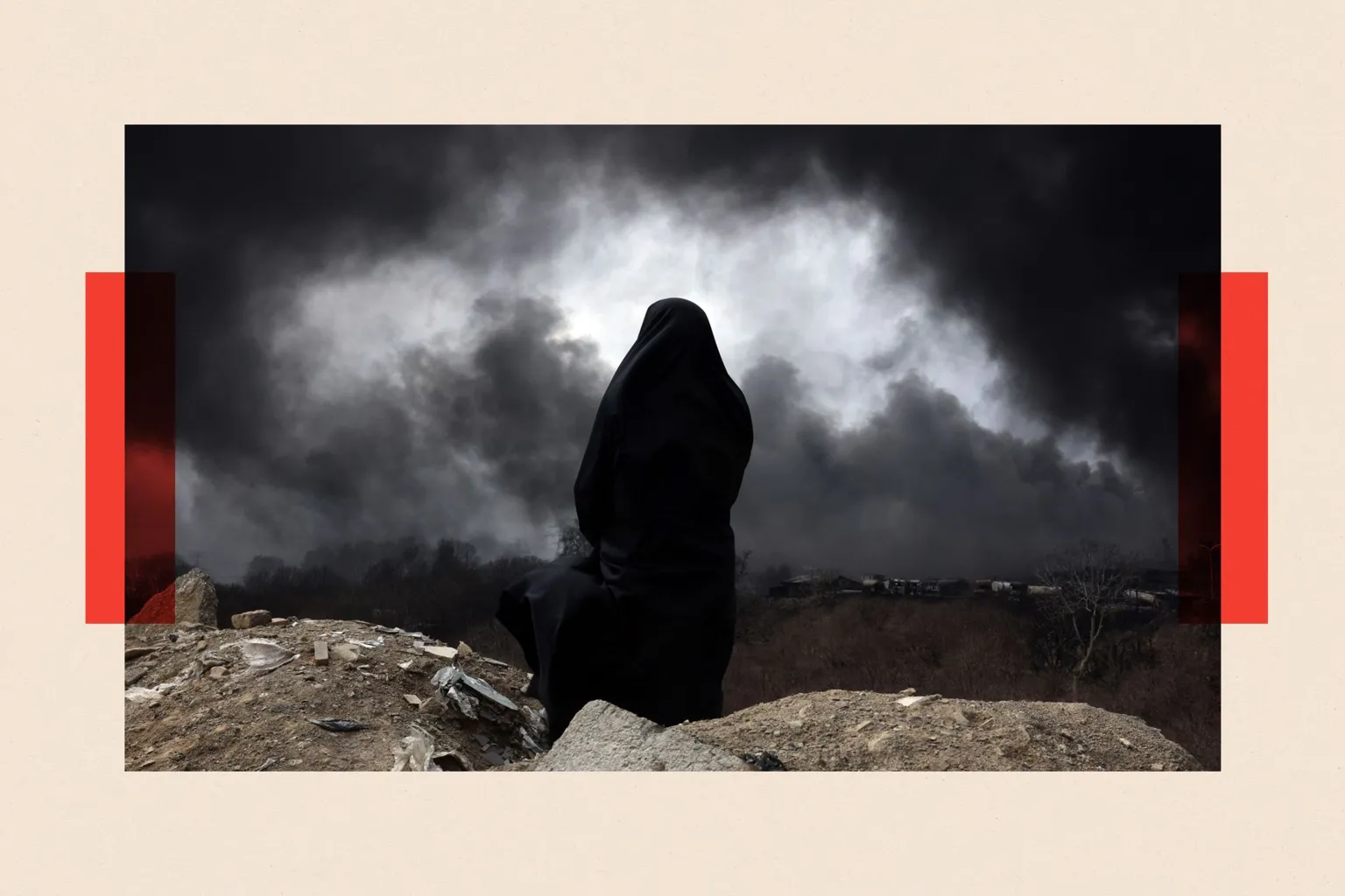 EPA/Shutterstock A view from the back of a woman wearing a chador, who surveys the scene as black smoke billows across the landscape
