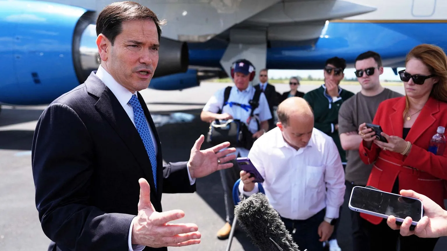 AFP via Getty Images US Secretary of State Marco Rubio speaks to the press in front of a plane