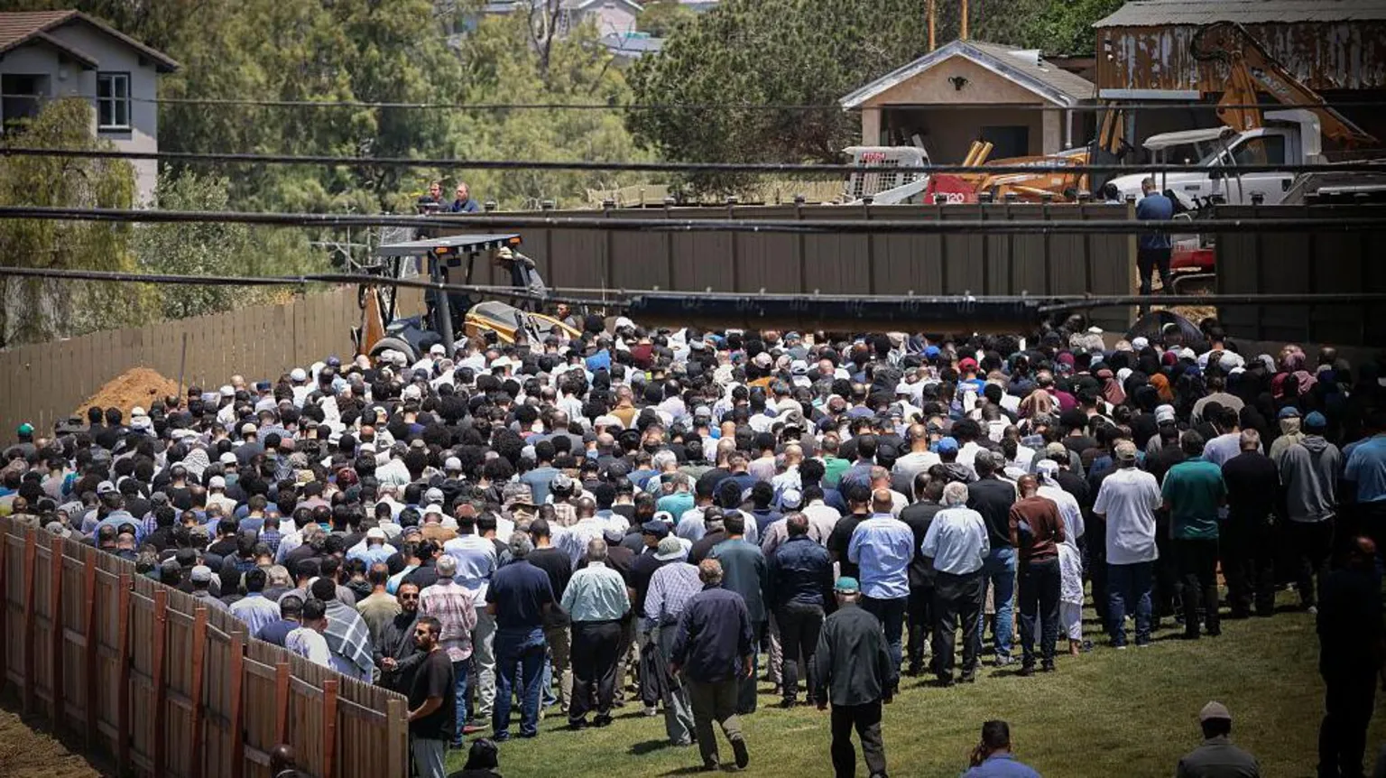 Getty Images People attend the burial service for Amin Abdullah, Mansour Kaziha and Nadir Awad at La Vista Memorial Park in National City on 21 May in San Diego, California. 